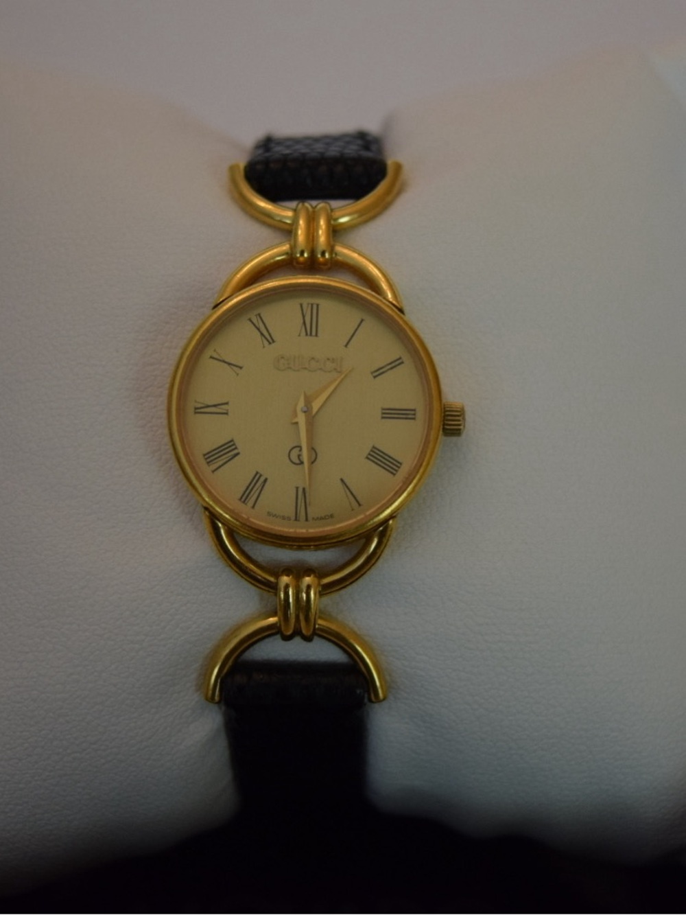 Gucci Women’s Gold-Tone Round Dial Watch with Black Leather Strap